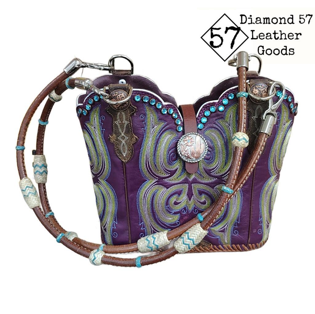Royal purple cowboy boot purse with aqua blue stitching, Aqua crystals, horse rein handles with rawhide braiding.