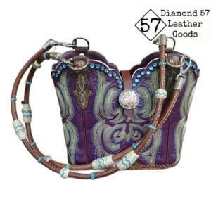 Royal purple cowboy boot purse with aqua blue stitching, Aqua crystals, horse rein handles with rawhide braiding.