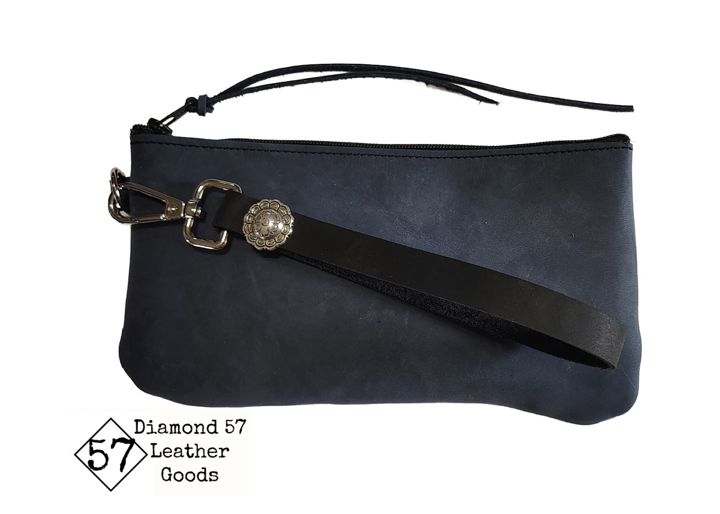 Black leather wallet with zipper closure, wristlet handle and concho.