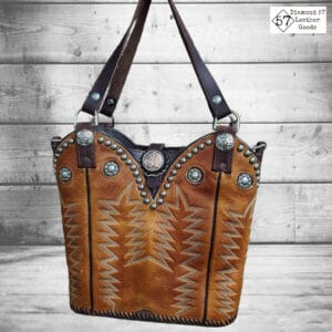 Brown cowboy boot purse with short handle and detachable long handle. Lots of conchos and engraved spots.