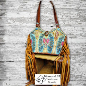 peace heart wings cowboy boot purse with fringe, conchos and lined with leather.